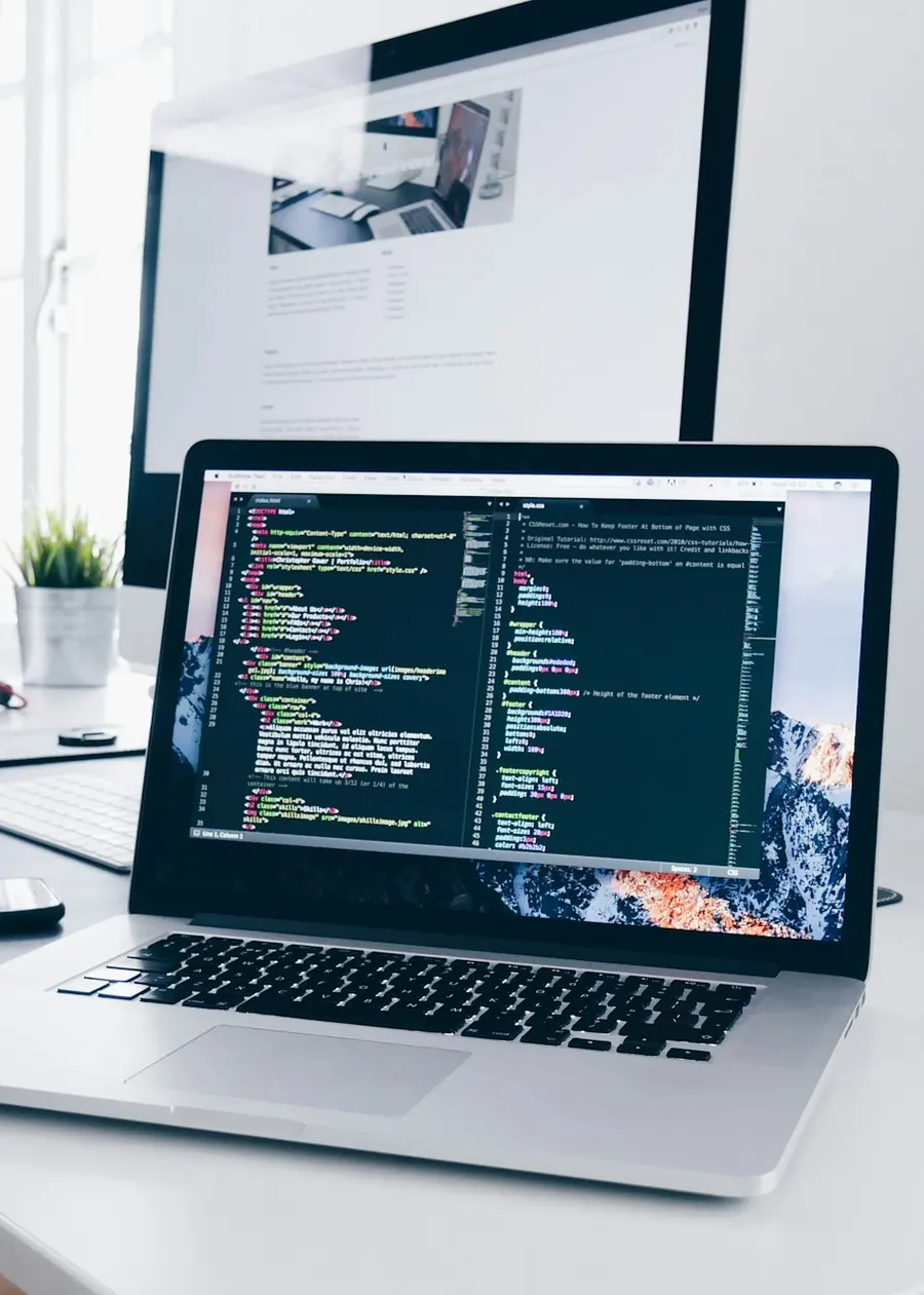 Developer building a web application on a laptop